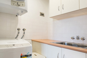 The Laundry of the Three Bedroom Apartment at Boulevard Apartments.