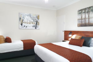 The King and Single Beds within one of the Triple Rooms.