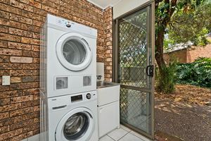 The Laundry of Centennial Terrace Apartments Superior 2 Bedroom Unit.