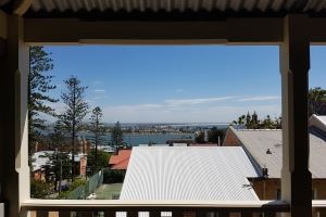 The view overlooking city from the first floor balcony of the Vista Apartment.